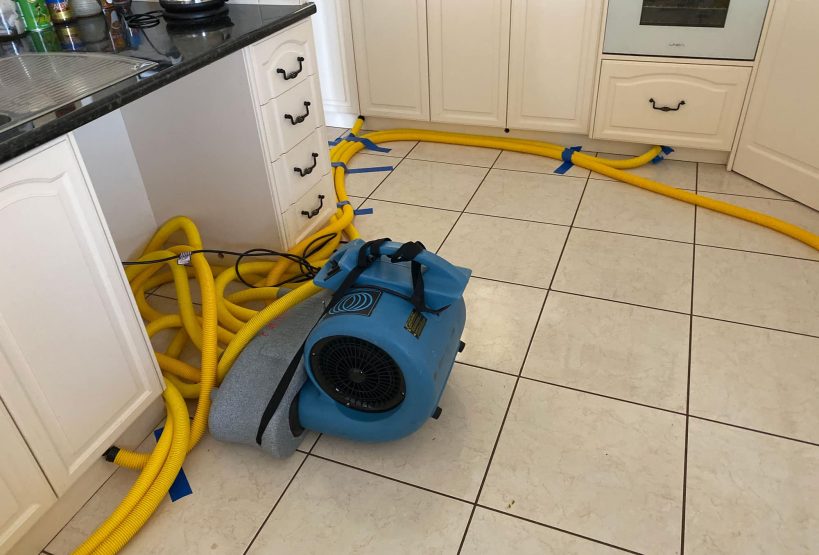 Kitchen floor with yellow hose — Restore All QLD In Kingaroy, QLD